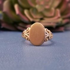 Beautiful oval signet ring in a Victorian revival style with filigree flourish design. This ring is unisex and would great on anyone! The ring can be taken to a local jeweler and monogramed.  Metal: 10k yellow gold Measurements: Center measures 14.48 x 10.15mm  Ring Size: 10 (Can be resized by a jeweler)  Time Period: Mid Century Victorian Signet Ring, Oval Engraved Ring With Classic Design, Classic Gold Engraved Oval Ring, Classic Oval Cabochon Signet Ring For Anniversary, Gold Oval Signet Ring With Engraving Option, Victorian Oval Engraved Ring For Anniversary, Formal Oval Engraved Filigree Ring, Formal Oval Engraved Ring With Classic Design, Classic Engraved Oval Cabochon Ring With Polished Finish