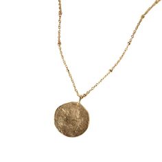 Minimalist yet delicate, this necklace seems to have been taken straight from an archeological excavation, turning it into a timeless treasure. 14k Gold Medallion Amulet Jewelry, Metal Necklace With Delicate Chain And Round Pendant, Delicate Metal Necklace With Round Pendant, Elegant Brass Medallion Necklace With Large Pendant, Metal Long Necklace With Round Pendant As Gift, Metal Medallion Necklace With Clavicle Chain Pendant, Minimalist Chain Necklace With Large Pendant, Minimalist Chain Necklace With Large Pendant As Gift, 14k Gold Amulet Medallion Jewelry