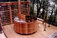 an outdoor hot tub on a wooden deck