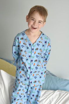 "Comfort is the main goal with this adorable pajama top pattern! This collarless button up PJ top pattern can be made in a large variety of woven fabrics and offers two sleeve lengths. Vick and Vicky's Button Up PJ Top is perfect for any season! You're little ones will love snuggling up in this one!  If you are looking for the full PJ Set please see my pajama set bundle. Pattern comes with a full tutorial and color photos in an easy to print PDF. Tutorial includes body measurements chart, fabric Casual Long Sleeve Patterned Sleepwear, Casual Button-up Sleep Tops, Long Sleeve Sleepwear With Button Cuffs, Long Sleeve Sleepwear With Button Cuffs For Loungewear, Printed Relaxed Fit Tops For Pajama Party, Playful Long Sleeve Sleep Top, Cotton Button-up Sleepwear, Cotton Button-up Sleepwear For Bedtime, Casual Printed Tops For Bedtime