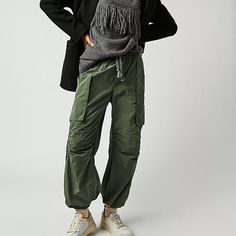 Style No. 79330031; Color Code: 037 Cool In Cargo, These Sporty Pants Are A True Timeless Staple. Fit: Mid-Rise, Tapered Fit And Classic Cargo Silhouette Features: Smocked Waistband With Drawstring Detail, Cargo Pockets Throughout, Banded Hemlines, Sleek Nylon Fabrication Why We <3 It: Just As Effortless As They Are Versatile, These Pants Have Endless Ways To Wear. Care/Import Machine Wash Cold Import Measurements For Size Small Waist: 30.5 In Hips: 42 In Rise: 12.25 In Inseam: 27.25 In 53% Nylo Fall Cargo Parachute Pants With Tapered Leg, Fall Parachute Cargo Pants With Tapered Leg, Fall Utility Parachute Pants With Tapered Leg, Fall Parachute Pants With Side Pockets And Tapered Leg, Fall Utility Parachute Trousers, Fall Tapered Leg Parachute Pants With Elastic Waistband, Fall Parachute Pants With Elastic Waistband And Tapered Leg, Winter Utility Nylon Parachute Pants, Winter Utility Cargo Pants With Elastic Waistband