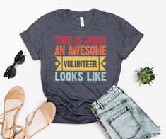 this is what an awesome volunteer looks like t - shirt with jeans and sunglasses on top