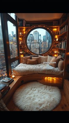 a living room filled with lots of furniture and bookshelves next to a large window