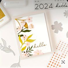 a card with flowers and leaves on it