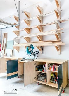 a workbench with lots of wooden shelves and tools