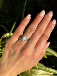 Oval Prong Setting Bridal Sets As Gift, Oval Bridal Sets With Prong Setting As Gift, Silver Opal Fine Jewelry, Fine Jewelry Stackable Opal Promise Ring, White Emerald Cut Halo Jewelry, Stackable Opal Promise Ring In Fine Jewelry Style, Adjustable White Gold Opal Ring, Dainty Oval Diamond White Jewelry, Dainty Diamond White Oval Jewelry