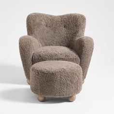 the chair and ottoman are made out of sheepskin