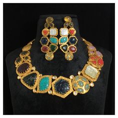 *Material: Brass *Plating: 22K Gold Plated *Stone: Semi Precious Gemstones *DIMENSIONS * *Necklace : Weight 83 gm *Earrings : Length 2.75 Inches , Width 1.25 Inches , Weight 15 gm Each *ABOUT PRODUCT* *This is a High Quality Navratan Necklace Set. *Style Tip : If you like both Traditional and contemporary... This set is certainly for you. *DISCLAIMER* *Product & color may slightly vary due to photographic lighting sources or your screen settings. Traditional Multicolor 22k Gold Necklaces, Traditional Multicolor 22k Gold Necklace, Multicolor 22k Gold Jewelry With Cutdana, Multicolor 22k Gold Cutdana Jewelry, Multicolor Cutdana 22k Gold Jewelry, Traditional Kundan Necklace With 17 Jewels For Diwali, Multicolor Necklaces With Intricate Design For Formal Occasions, Multicolor Intricate Design Necklaces For Formal Events, Formal Multicolor Necklaces With Intricate Design