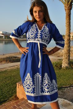 This beautiful bohemian embroidered tunic dress is surely going to add life and oriental charm to your closet. The dress is made of Egyptian cotton which is widely renowned for its quality and texture. The dress is light and extremely soft and can be used on many occasions - beach, lounge, or even in your home to feel comfortable. Fabric : 70% Egyptian Cotton; 30% Polyester. Tunic measurements in inches : Small (Size 4/6 USA) Bust : 36-37 Hip : 40-41 Medium (Size 8/10 USA) Bust : 39-40 Hip : 45- V-neck Dress With Intricate Embroidery For Eid, Traditional V-neck Embroidered Dress, Bohemian V-neck Kurta With Intricate Embroidery, Traditional V-neck Dress With Embroidered Neckline, Cotton Embroidered Dress For The Beach, Cotton Embroidered Dress For Beach, Traditional Maxi Length Embroidered Dress, Traditional Embroidered Boho Tunic Dress, Traditional Embroidered Maxi Dress With Embroidered Neckline