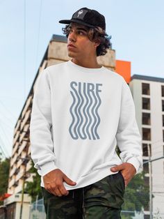 Get ready to hit the waves with our surf sweater! This is a piece of clothing that features a bold, graphic design of the word "surf" in a distinctive font with a wavy vibe. This type of sweater is popular among those who love to hit the waves and embrace a laid-back, beachy lifestyle. It's the perfect garment for wearing on a casual day out at the beach, or for hanging out with friends on a cool summer evening. The sweater is made from a soft and comfortable fabric that will keep you warm and c