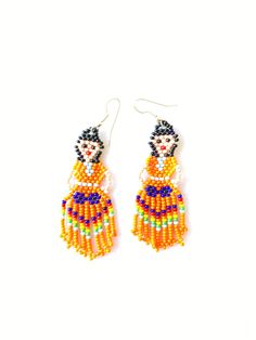 Huichol earrings These handmade beaded earrings are so colorful and lightweight. They are unique and made by the huichol artisans Huichol art and handcrafts are popular worldwide because of the beauty of the jewelry they make and all the art and tradition that the community represents 100% handmade Please notice that due all the light effects, color may vary slightly All orders are shipped using Mexican Postal Service and it takes: 15-25 bussines days (North America). 20-30 bussines days (Europe Mexican Wedding Decorations, Mexican Party Favors, Cactus Party Decor, Doll Earrings, Huichol Earrings, Jewelry Mexican, Woman Earrings, Mexican Doll, Mexican Earrings