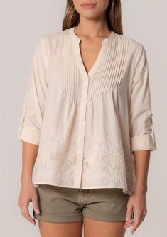 A cotton long sleeve bohemian spring blouse with embroidered detail. Cotton Embroidered Relaxed fit Long rolled sleeve with button tab closure Hip length V-neckline Self-covered button front Pintuck details Lined Bohemian spring blouse An elevated take on a classic style. Our cotton long-sleeve blouse features delicate pintuck details, a self-covered button front, and a flattering v-neckline. The embroidered detail adds a bohemian touch. Model is 5'9, wearing a size S.Style: I-15088W-SGI Spring Blouse, Pick Stitch, Spring Blouses, Cute Spring, Pin Tucks, Embroidered Blouse, Boho Tops, Online Sales, Hip Length