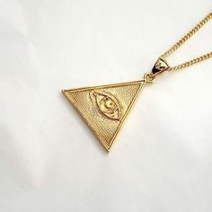 women's and men's triangle the Eye of Providence necklace pendant 2 made in 14k solid gold or 18k solid gold the eye of providence with exquisite details is on a triangle pendant. the Eye of Providence is a symbol that depicts an eye, meant to represent divine providence, whereby the eye of God watches over humanity. - this pendant height is 25.5mm without the bail. - model wears a 1.7mm 50cm chain. - materials: real 14k solid gold, real 18k solid gold - designed by carre d'or - made in South Korea 14k gold pendant necklace weight pendant only 3.94g (±3%) with a 1.4mm 42cm chain 6.80g (±3%) with a 1.7mm 42cm chain 8.02g (±3%) with a 2.1mm 42cm chain 9.90g (±3%) 18k gold pendant necklace weight pendant only 4.70g (±3%) with a 1.4mm 42cm chain 8.11g (±3%) with a 1.7mm 42cm chain 9.51g (±3%) Triangle Yellow Gold 14k Jewelry, 14k Gold Triangle Jewelry, 14k Gold Triangle Shaped Jewelry, 14k Gold Triangle Jewelry In Gold Color, The Eye Of Providence, Triangle Eye, Gold Necklace Pendant, Divine Providence, Eye Of Providence