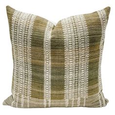 a green and white striped pillow on a white background