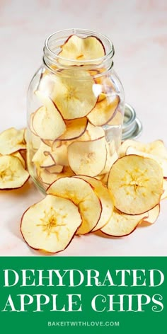 sliced apples in a glass jar with the words, dehydrated apple chips