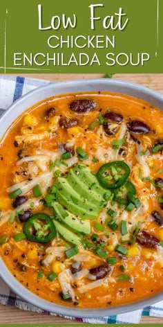 a bowl filled with chicken enchilada soup and topped with avocado