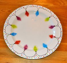 a white plate with colorful lights on it