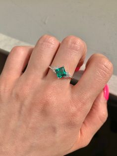 This gorgeous, timeless ring features our favorite stunning emerald design and hand picked crystals. ✦ DETAILS ✦ ✧ Handcrafted ✧ About 2.25 Carat center stone ✧ Natural crystals ✧ Sizes 3.5-11 ✧ Sterling Silver 925 or gold filled ✧ This ring will arrive ready to gift in a Kherish Jewelry Pouch. ✧ PRE-ORDER: Items that are preorder only will ship within 10-15 business days. You will receive an email with the updated processing time if you order a size/option that qualifies for pre-order. ✧ Due to Dazzling May Birthstone Jewelry For Anniversary, Dazzling May Birthstone Jewelry For Anniversaries, Cubic Zirconia May Birthstone Ring, Fine Jewelry Emerald Crystal Ring With Accent Stones, Dazzling Emerald Jewelry For Promise Ring, Dazzling Emerald Ring With Prong Setting For Anniversary, Dazzling Cubic Zirconia Emerald Ring For Anniversary, Dazzling Emerald Jewelry With Accent Stones, Formal Cubic Zirconia Crystal Ring For May Birthstone