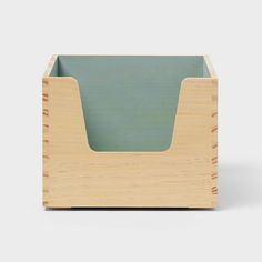 a wooden box with a green lid on it's front and side sides, in the shape of a rectangle