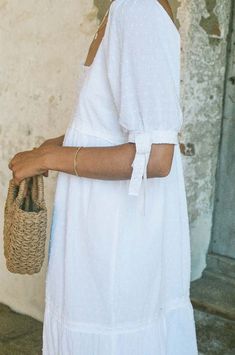 This long white cotton lace dress is one of our favorite dresses we have made so far.   the white lace dress is a classic that is perfect for daytime all spring and summer long.      the long white lace dress is made of a beautiful swiss dot cotton fabric is fully lined and finished with lace details.  the sleeves are elbow length and are finished with a lace bow tie on each side.    the dress makes you feel extra pretty is extra flattering and is in a pretty white.    made from cotton one of the best natural and sustainable materials there are that makes you and your skin happy you are wearing it:).  dress is preshrunk for quality assurance.    - loose comfortable fit  - 100% cotton  - preshrunk for ultimate quality  - fully lined  - cold wash tumble dry low  - may dry clean light bleach Long White Lace Dress, White Cotton Lace Dress, White Lace Dress Long, Cotton Lace Dress, Swiss Dot Dress, Dress With Lace Trim, Parker Dress, White Cotton Dress, White Lace Dress