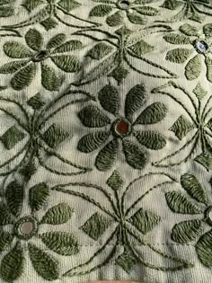 a close up view of an embroidered fabric