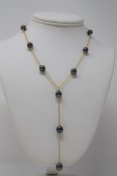 A sexy, modern design with exotic Tahitian black pearls. 🤍 Materials- 8 mm near-round, high grade, black Tahitian pearls (with overtones of green, blue, purple, and pink), gold filled chain and lobster clasp SizeLength: 17” chain with 4” drop Note* All jewelry is lovingly handmade by me. Quantities are limited. Craftsmanship is guaranteed. Orders arrive gift wrapped and ready for giving. Please allow 5-7 business days for production. Luxury Black Pearl Chain Necklace, Luxury Black Tahitian Pearl Necklaces, Formal Black Tahitian Pearl Necklace, Formal Black Tahitian Pearl Jewelry, Black Tahitian Pearl Necklace With Pendant, Black Tahitian Pearl Jewelry With Round Beads, Black Tahitian Pearl Round Beads Jewelry, Formal Black Tahitian Pearl Necklaces, Black Tahitian Pearl Necklaces With Round Beads