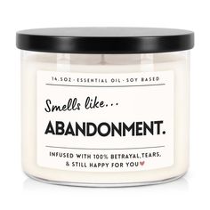 an open jar of candle that says smellless like abandonment with the words,