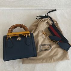 Like New - Two (2) Crossbody Straps Included - Gucci Box And Dust Bag Included High-end Blue Tote Box Bag, Gucci Rectangular Bag With Bamboo Handle, Gucci Bamboo Handle Rectangular Bag, Gucci Satchel With Bamboo Handle, Gucci Luxury Shoulder Bag With Bamboo Handle, Luxury Gucci Shoulder Bag With Bamboo Handle, High-end Blue Box Bag For Daily Use, Designer Shoulder Bag With Bamboo Handle For Daily Use, Designer Handheld Bags With Bamboo Handle