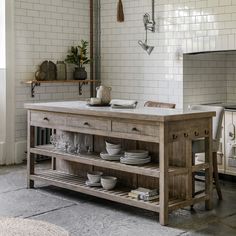 a kitchen island with plates and bowls on it