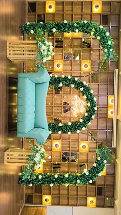 an overhead view of a room with wooden walls and green plants on the wall, along with candles