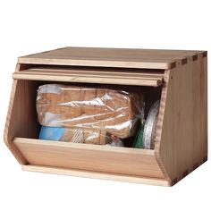 a wooden box filled with food on top of a white background