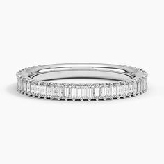 a white gold band with baguetts and diamonds