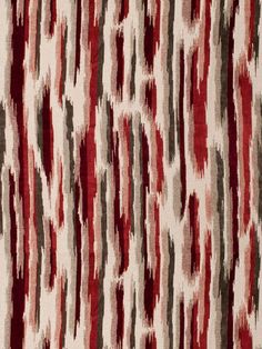 a red and white rug with many different patterns on it's surface, including stripes