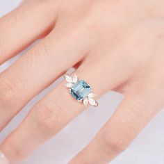 The gentle light blue color of our stunning, hand-chosen aquamarine is the perfect compliment to our gorgeous Ivy ring design. Each ring is made from premium sterling silver to add a little luxury and charm; meanwhile, we’ve included six gorgeous crystals to help every ring shine on any occasion. The perfect design to give your wardrobe a boost! ✦ DETAILS ✦✧ Handcrafted ✧ 2.0 Carat center stone✧ Aquamarine and crystals ✧ Sizes 3.75-11.25✧ This ring will arrive ready to gift in a Kherish Jewelry Aquamarine Ring Rose Gold, Light Blue Ring, Ivy Ring, Timeless Ring, Blue Ring, Opal Ring Gold, London Blue Topaz Ring, Aquamarine Ring, Ring Rose Gold