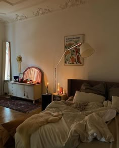 a bed room with a neatly made bed next to a window