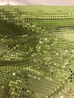 "LIME GREEN SEQUIN FABRIC Product Information 1 mtr 6mm lime green all over sequin fabric 45\" wide 114cm The woven non stretch kind of sequin fabric is most commonly used for dress making as it is well suited to designs that would be made from woven fabrics in general such as gowns,jackets,skirts and trousers. Ideally used for decorations,dress making,bridal,,dress lining,waistcoats,jackets,table runners,crafts, drapery,decorations and many other projects Sold by the mtr If more than one quantity is bought it will be sent as one continous length" Luxury Green Sequin Fabric For Party, Green Sequin Dress With Contrast Sequin For Spring, Festive Green Sequin Party Dress, Festive Green Sequin Dress For Party, Spring Green Sequin Dress With Contrast Sequins, Glamorous Green Sequin Wedding Dress, Iridescent Sequin Fabric For Summer, Stretch Sequin Fabric For Summer Parties, Disco Sequin Fabric For Summer Festivals