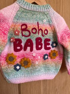 🌺Boho Babe 🌺✌️ This hand embellished, hand knitted cardigan is perfect for your little boho babe. Know anyone going to a festival this summer? This could be a lovely little cardi for them! 🎪🎶 It's knitted in a beautiful rainbow colourway with a comfortable fit and little pink flower buttons This cardigan comfortably fits size 12-18 months, it could even fit up to 2 years. Measurements to follow Pink Knit Cardigan For The Beach, Pink Bohemian Knitted Sweater, Pink Bohemian Knit Cardigan, Bohemian Pink Knit Cardigan, Pink Hand Knitted Bohemian Sweater, Hand Knitted Bohemian Pink Sweater, Pink Bohemian Hand Knitted Sweater, Pink Bohemian Hand-knitted Sweater, Bohemian Knitted Beach Sweater