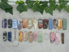 These are keychain keyrings, each with a polished gemstone and a glued on metal bail where the keychain will be attached to.  Crystals are connected to the keychain with a circular jumpring with the total chain length being around 30mm.  The splitring keyring itself is 25mm. A great way to take a worry stone with you wherever you go!  There are 24 different gemstones to choose from, with five of each being posted here in the photos.  If you have a particular shape preference that you see in the Gemstone Keychain Diy, Gemstone Keychain, Gift Multi-stone Round Beads Gemstones, Crystal Keychain, Multicolor Hand-strung Beads, Gems, And Cabochons For Gifts, Worry Stones, Chain Lengths, Chain Length, Keychains