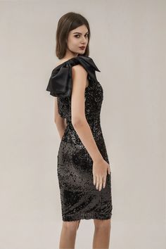 A chic dress with romantic allure is our Amari Black Sequin Dress. Putting it on, people will never stop complimenting you. We have designed a one-shoulder dress with bow straps. Delicate sequins inlaid all over. Wear it with heels and go the night away.  Dress Length: Approx 97cm Materials: Spandex Gentle Dry Clean Only  Model is 5 ft 7 and wears size S  Colour may vary due to lighting on images. The product images (without model) are closest to the true colour of the product.  Item runs true t Elegant Off-shoulder Sequin Evening Dress, Elegant One-shoulder Contrast Sequin Dress, Elegant One-shoulder Dress With Contrast Sequin, Elegant One Shoulder Contrast Sequin Dress, One Shoulder Sequin Dress For Gala, One Shoulder Sequin Dress For Gala Party Season, Black Party Dress With Bow Tie Back, One-shoulder Sequin Dress For Gala Holiday, Holiday Gala One Shoulder Sequin Dress