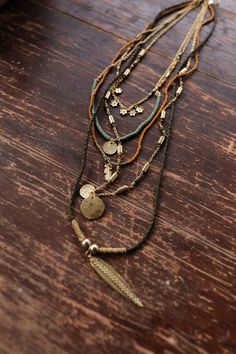 Perfect for the expressive soul the Odessa Necklace is a boho gals dream! You'll love finishing your look with this boho statement piece because it features: Long necklace style with 5 unique layers Mixed layers of rope and chains So cute mix of green, orange, and gold beads with gold pendants of flowers, feathers, and circles Classic lobster claw closure with a 2" extender *Due to lighting and differences in monitors, actual colors may vary slightly from what appears online. Model is 5'8" and w