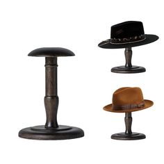 three hats are sitting on top of each other in different styles and sizes, including one brown hat