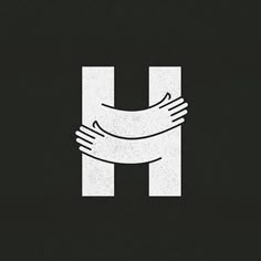 two hands holding each other over the letter h