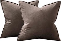 two grey velvet pillows sitting next to each other