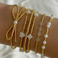 Trendy Gold Beaded Bracelets, Trendy Gold Stretch Bangle Bracelet, Gold Beaded Bangle Pearl Bracelet, Gold Bangle With Colorful Beads, Gold Beaded Pearl Bangle Bracelet, Adjustable Gold Stretch Bracelet With Colorful Beads, Adjustable Gold Stretch Bracelet With Tiny Beads, Trendy Gold Beaded Bracelets With Colorful Beads, Flexible Gold Beaded Bracelets With Tiny Beads