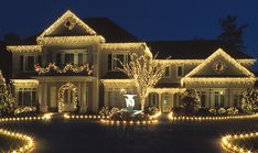 a large house covered in christmas lights