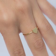 Beautiful, and dainty heart ring. ✿ Details ✿ ✤ Made of 925 Sterling Silver ✤ Available in 14k Gold or Rhodium Plated ✤ We use a THICK plating of 14k Gold for a piece that is sure to last years to come ✤ Nickel-free ✤ WILL NOT TURN FINGER GREEN! ✤ Available in Sizes 4, 5, 6, 7, 8, 9, or 10 ✤ Heart Measures 7 x 7 mm Stacking Rings Shown on Model: https://www.etsy.com/listing/739952471/dainty-diamond-stacking-eternity-ring?ref=shop_home_active_8&pro=1 https://www.etsy.com/listing/770233900/bra Everyday Stackable Heart Ring, Stackable Everyday Heart Ring, Minimalist Stackable Rings With Heart Charm For Promise, Delicate Heart Ring For Gifts, Dainty Heart-shaped Tiny Midi Rings, Dainty Everyday Heart-shaped Rings, Dainty Midi Rings With Heart Charm, Dainty Midi Promise Rings With Heart Charm, Heart Shaped Stackable Rings For Everyday