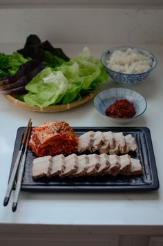 the meal is prepared and ready to be eaten on the table with chopsticks