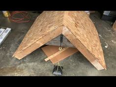 a wooden structure is being constructed in a garage