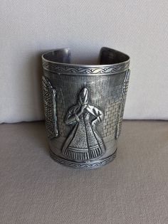 Vintage Peruvian Folkloric Sterling Long Cuff Bracelet - Artistic Etched Picture w Onlayed Design - Fine Execution - Makers Mark, Peru, .925 - No Scratches, Cracks or Dents - Like New Vintage Condition Etched Design is of a Tiled Walkway and Patterned Wall with Etched Onlays of Woman wearing Shawl, Window and Doorway on Street Scene.  Beautiful Scallop Design etched into edges of bracelet - Spanish Colonial influence Specifications:  Total Weight: circa 151.1 grams (c 5.32 oz) Size:  circa 3 1/2" L x Tapers from 2 3/8" to 2 5/8" W - Opening on back c 1 3/8" Flexible enough to open wider to accommodate a larger arm. Smooth Edges for a NO Scratch Wear. Installment Payments Available at Checkout!  Returns accepted if in Original Shipped Condition - Do NOT Polish It will be necessary to sign f Artistic Engraved Formal Jewelry, Handmade Sterling Silver Collectible Bracelet, Artistic Metal Cuff Bracelet Bangle, Traditional Etched Cuff Bracelet, Artistic Metal Cuff Bracelet, Collectible Cuff Bracelet With Intricate Design, Collectible Cuff Bangle With Intricate Design, Collectible Cuff Bracelet Bangle With Intricate Design, Traditional Handmade Cuff Bracelet For Formal Wear