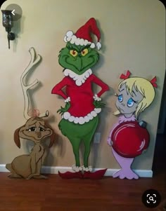 the grinch family is standing next to each other